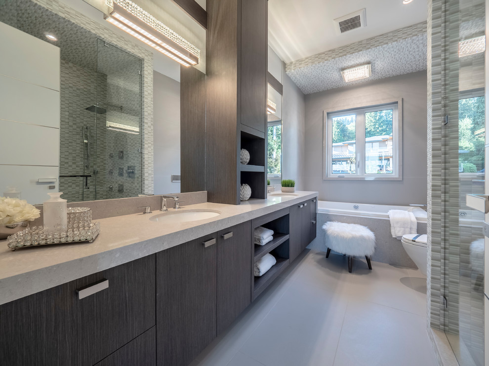Design ideas for a mid-sized contemporary master bathroom in Vancouver with flat-panel cabinets, brown cabinets, a corner shower, matchstick tile, grey walls, a hinged shower door, a drop-in tub, porcelain floors, an undermount sink, grey floor and beige benchtops.