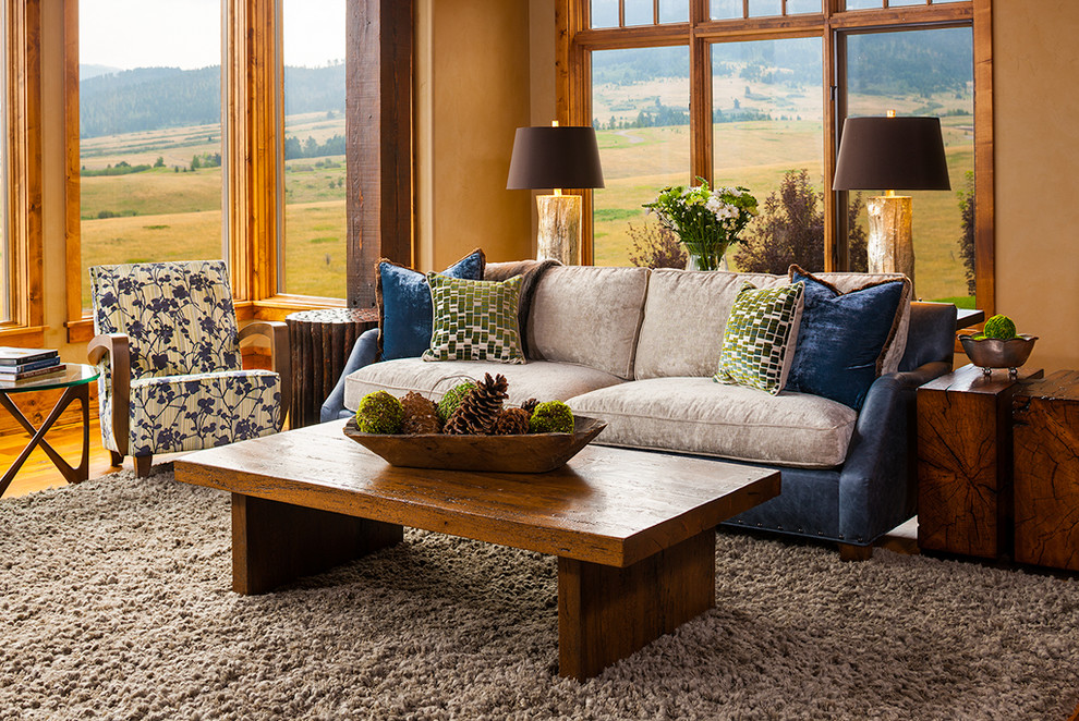 Photo of an expansive country open concept living room in Other with medium hardwood floors.