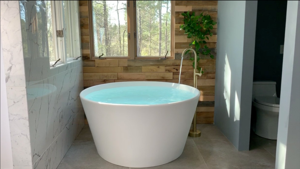Design ideas for a large scandinavian master bathroom in Atlanta with flat-panel cabinets, blue cabinets, a freestanding tub, a curbless shower, a one-piece toilet, white tile, porcelain tile, blue walls, porcelain floors, an undermount sink, engineered quartz benchtops, grey floor, a hinged shower door and white benchtops.