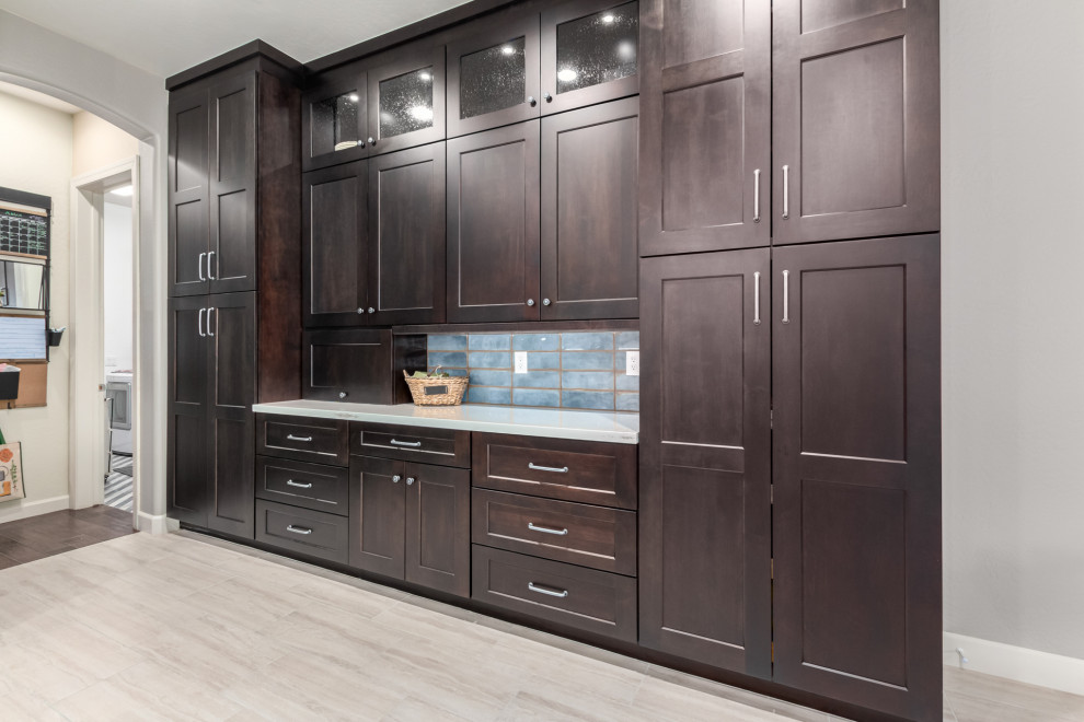 Inspiration for a rustic kitchen remodel in Phoenix with a farmhouse sink, shaker cabinets, dark wood cabinets, quartz countertops, blue backsplash, subway tile backsplash and white countertops