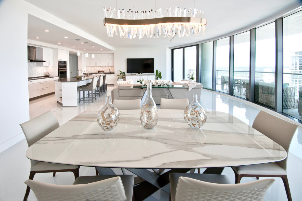 Design ideas for a mid-sized contemporary open plan dining in Miami with white walls, porcelain floors and wallpaper.