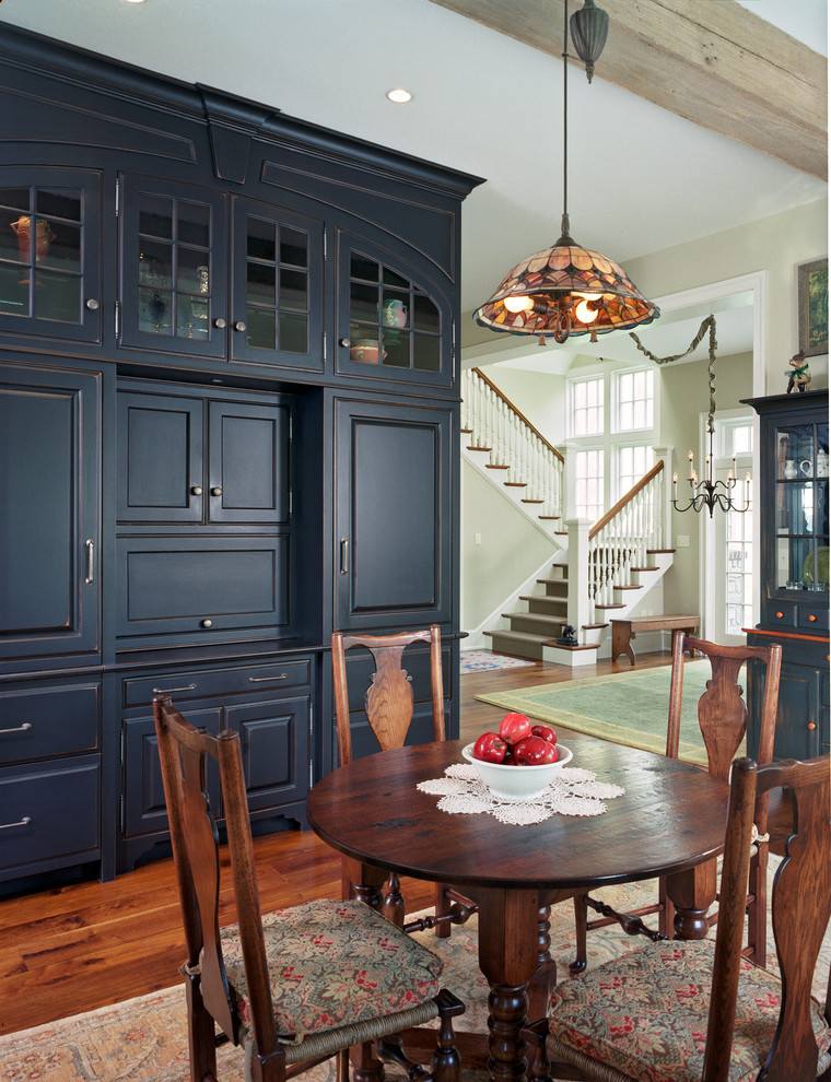Design ideas for a traditional dining room in Philadelphia with beige walls and dark hardwood floors.