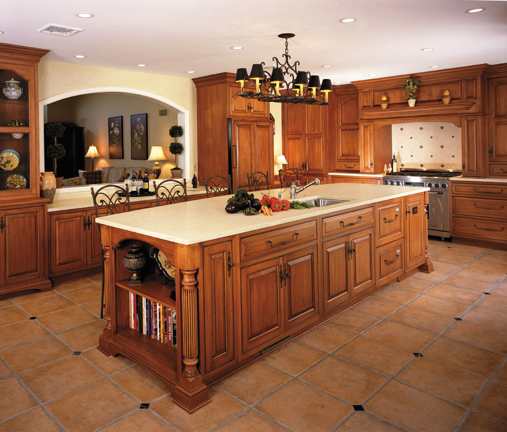 Inspiration for a large traditional u-shaped separate kitchen in Philadelphia with an undermount sink, raised-panel cabinets, medium wood cabinets, multi-coloured splashback, stainless steel appliances, terrazzo floors, with island, brown floor and beige benchtop.