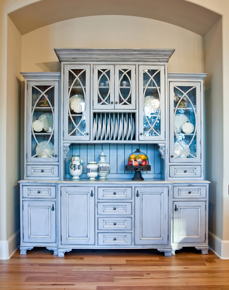 Traditional kitchen in Charleston with blue cabinets.