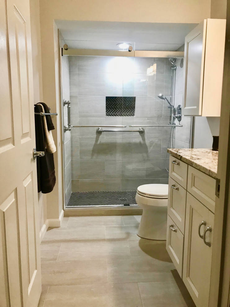 Design ideas for a mid-sized modern kids bathroom in DC Metro with recessed-panel cabinets, white cabinets, an alcove shower, a two-piece toilet, brown tile, porcelain tile, yellow walls, porcelain floors, an undermount sink, quartzite benchtops, brown floor, a sliding shower screen, brown benchtops, a single vanity and a built-in vanity.