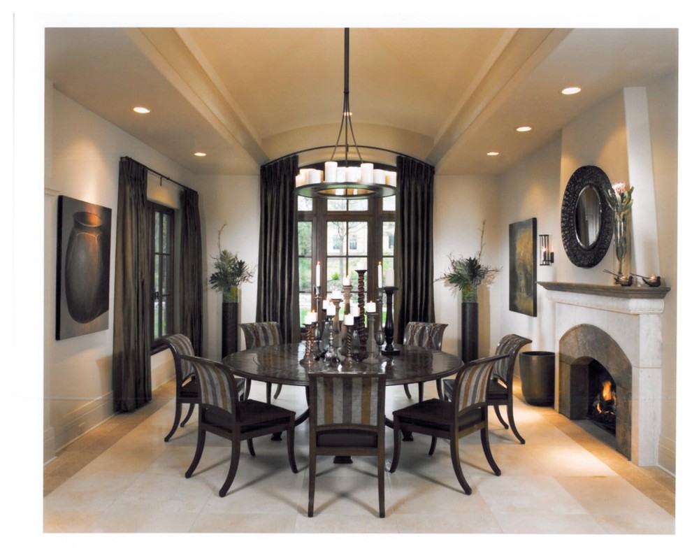 Design ideas for a large traditional separate dining room in Chicago with beige walls, limestone floors, a standard fireplace and a stone fireplace surround.