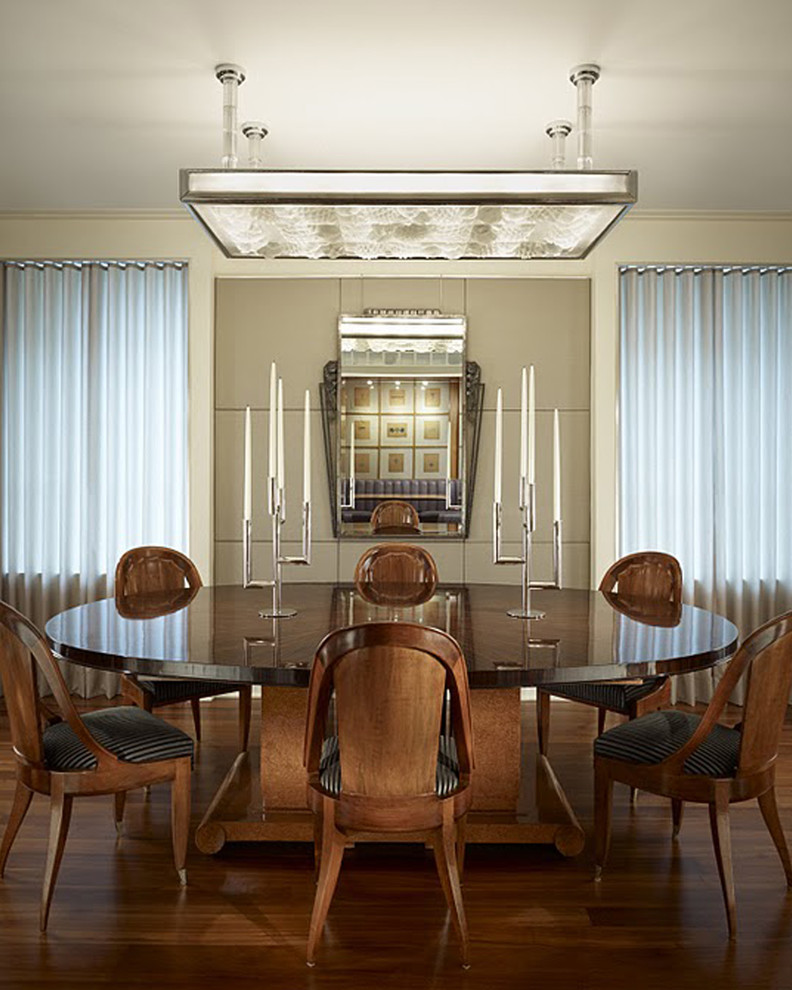 Inspiration for a contemporary dining room in Chicago with beige walls and dark hardwood floors.