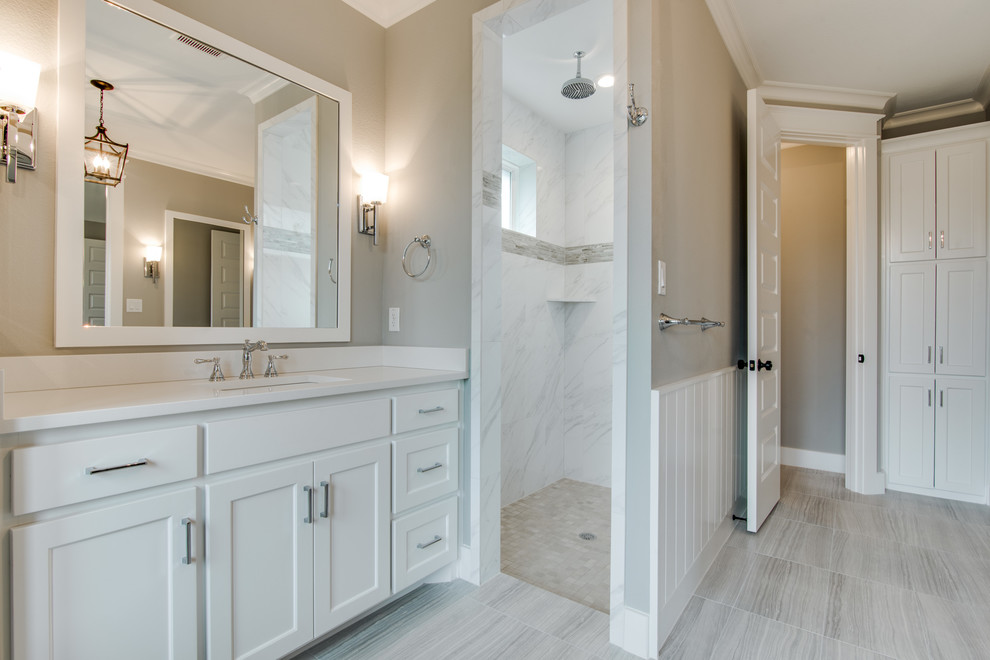 Example of a mid-sized transitional master freestanding bathtub design in Dallas with shaker cabinets