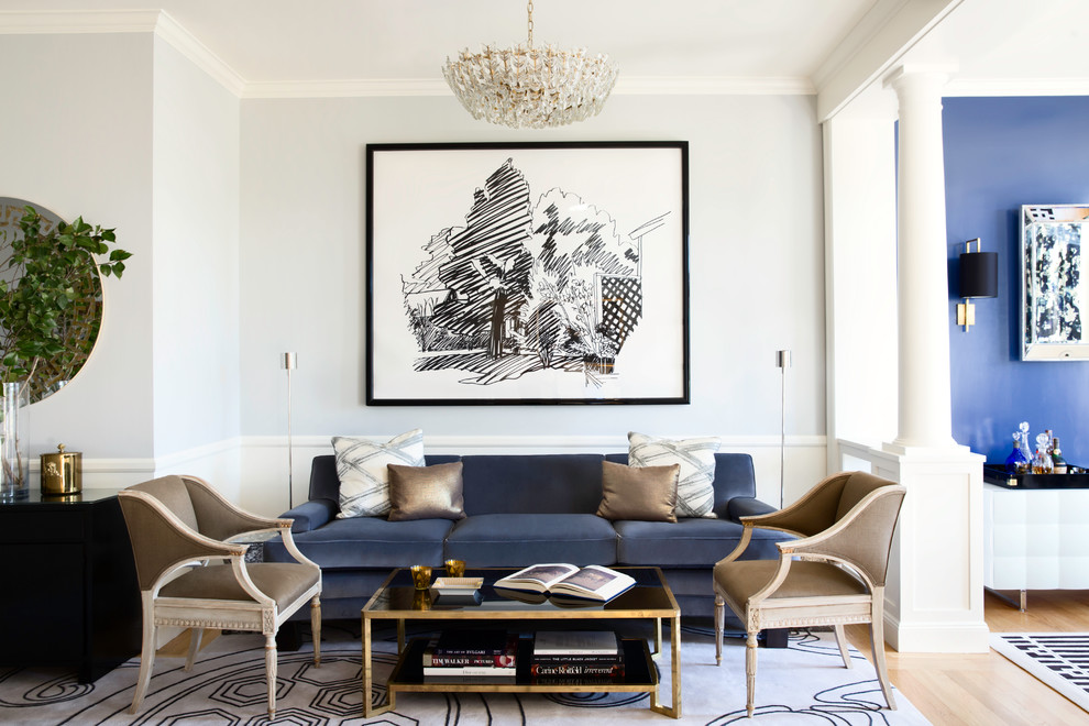 This is an example of a large transitional living room in San Francisco with white walls and light hardwood floors.