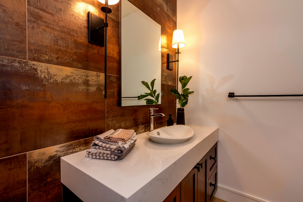 Small transitional 3/4 bathroom in Seattle with shaker cabinets, brown cabinets, white tile, porcelain tile, white walls, porcelain floors, a vessel sink, solid surface benchtops, brown floor, white benchtops, a single vanity and a built-in vanity.