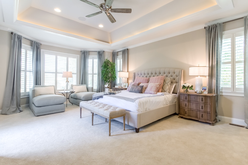 Inspiration for a large traditional master bedroom in Richmond with carpet, beige floor and beige walls.