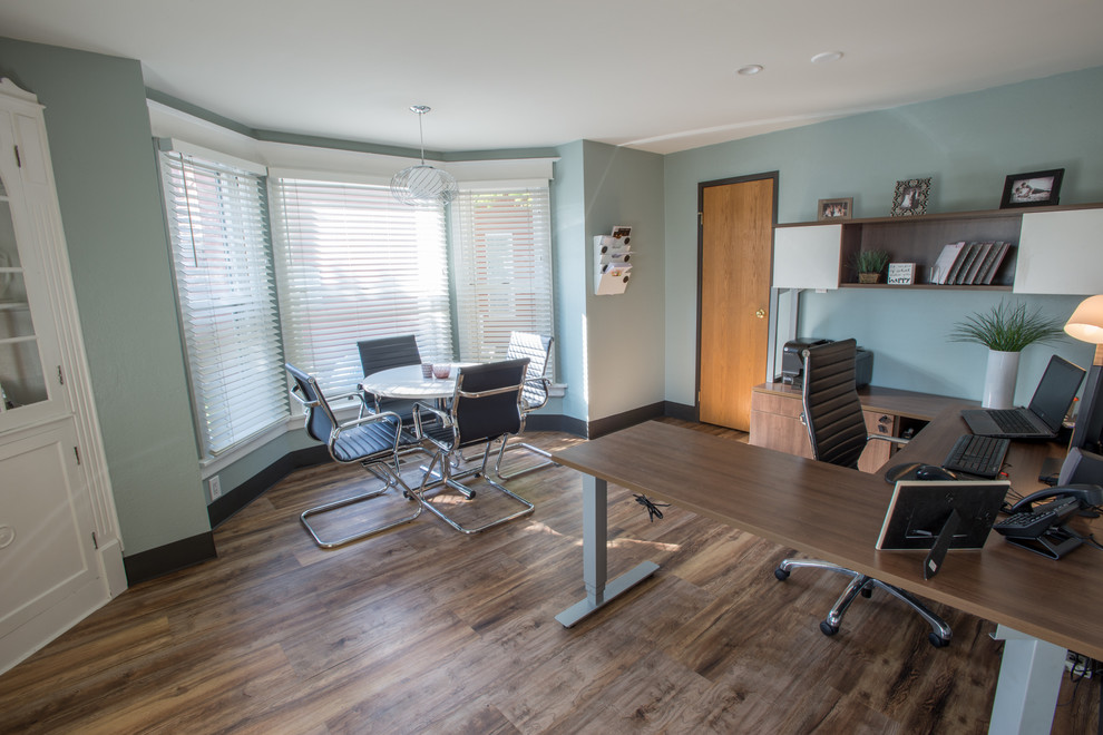 Inspiration for an expansive modern home office in Denver with blue walls and vinyl floors.