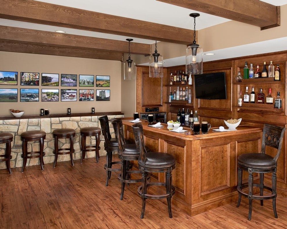 Inspiration for a large arts and crafts l-shaped seated home bar in New York with an undermount sink, recessed-panel cabinets, medium wood cabinets, wood benchtops, brown splashback, timber splashback and medium hardwood floors.