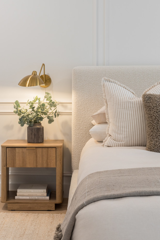 Example of a transitional bedroom design in Tampa