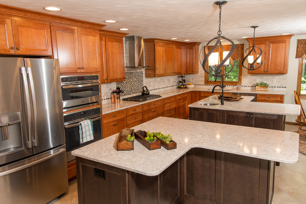 Huge transitional l-shaped porcelain tile and white floor eat-in kitchen photo with an undermount sink, flat-panel cabinets, medium tone wood cabinets, quartz countertops, white backsplash, ceramic backsplash, stainless steel appliances, two islands and white countertops