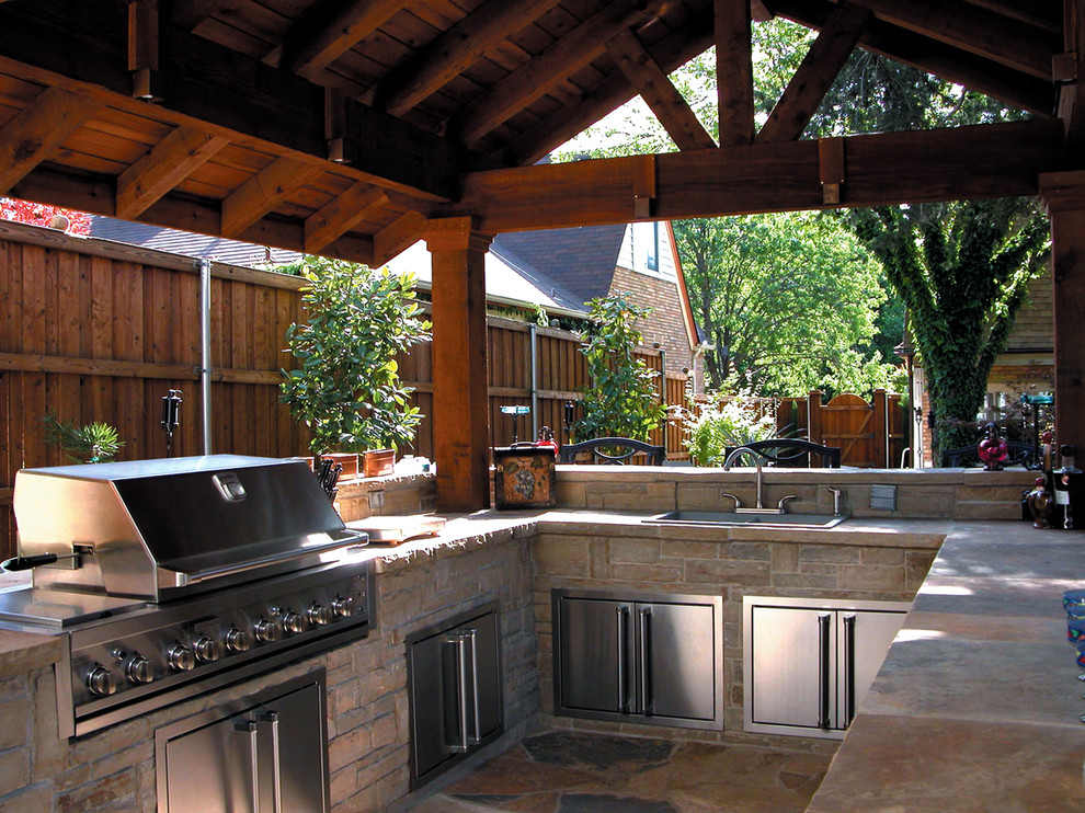 Inspiration for a mid-sized traditional backyard patio in Dallas with an outdoor kitchen, stamped concrete and a gazebo/cabana.