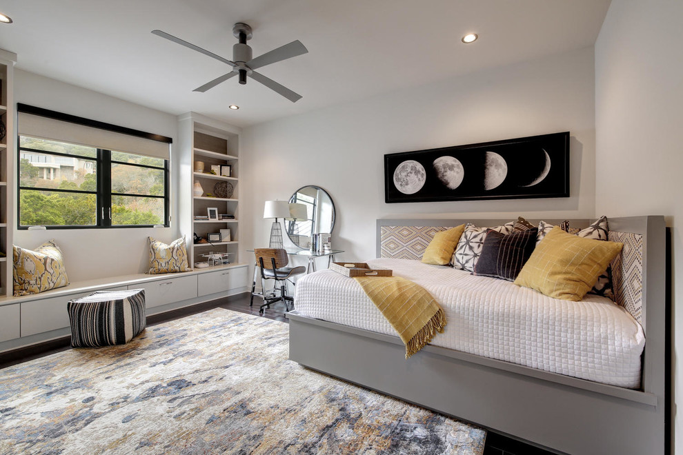 Photo of a transitional bedroom in Austin with white walls and carpet.