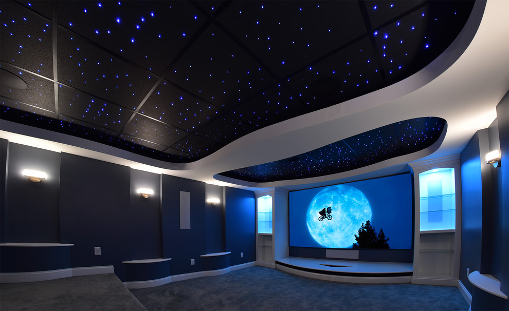 Mid-sized modern enclosed home theatre in Cleveland with a projector screen.