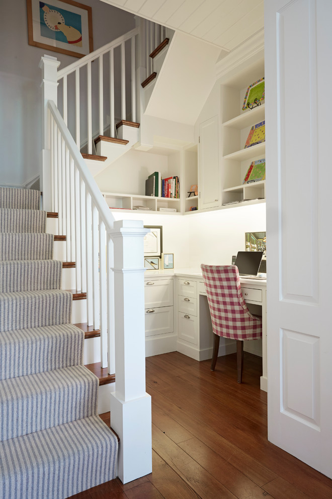 Inspiration for a country home office in Richmond with white walls, medium hardwood floors and a built-in desk.