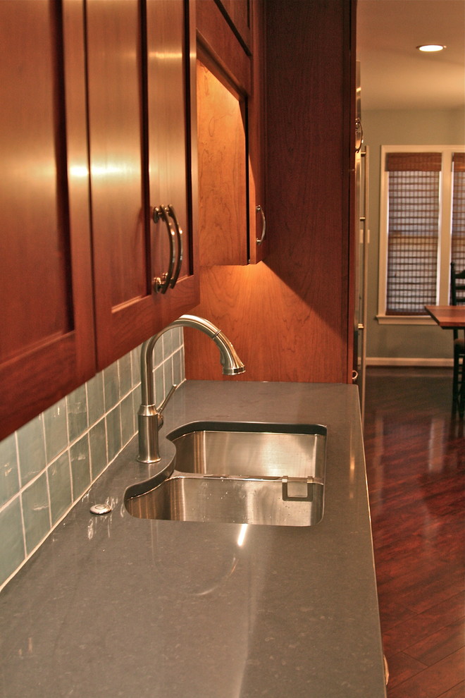 Inspiration for a transitional laminate floor kitchen remodel in DC Metro with shaker cabinets, quartz countertops, blue backsplash and porcelain backsplash