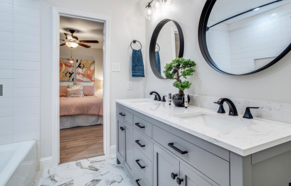 Photo of a small farmhouse bathroom in Dallas with flat-panel cabinets, grey cabinets, a built-in bath, a shower/bath combination, an urinal, white tiles, white walls, marble flooring, a submerged sink, engineered stone worktops, multi-coloured floors, a shower curtain, white worktops, an enclosed toilet, double sinks and a built in vanity unit.