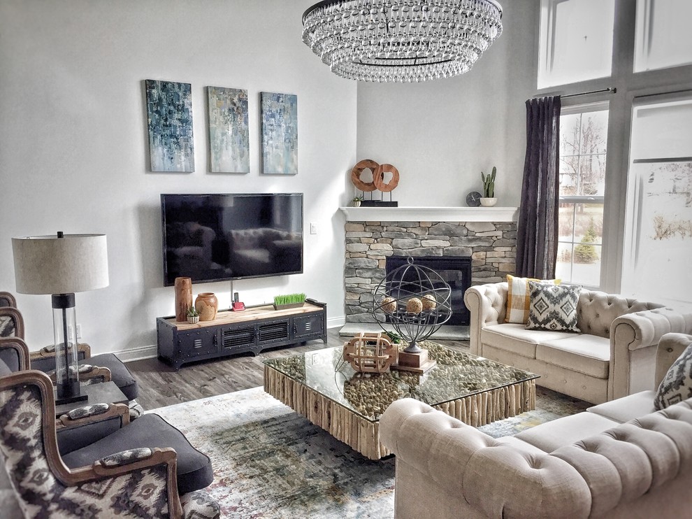 Mid-sized transitional formal open concept living room in Indianapolis with white walls, dark hardwood floors, a corner fireplace, a stone fireplace surround, a wall-mounted tv and grey floor.