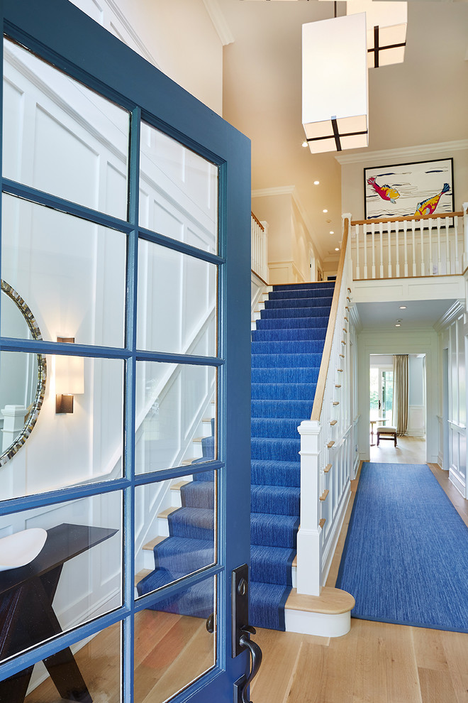 Inspiration for a mid-sized contemporary foyer in New York with white walls, a single front door and a blue front door.
