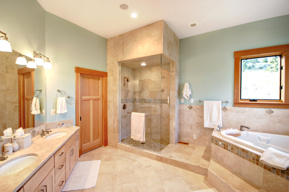Photo of a mid-sized country master bathroom in Other with an undermount sink, flat-panel cabinets, light wood cabinets, marble benchtops, a corner tub, a corner shower, beige tile, ceramic tile, green walls and ceramic floors.