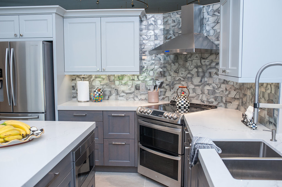 Inspiration for a mid-sized transitional u-shaped porcelain tile and beige floor eat-in kitchen remodel in Miami with an undermount sink, shaker cabinets, gray cabinets, quartz countertops, gray backsplash, glass tile backsplash, stainless steel appliances, an island and white countertops