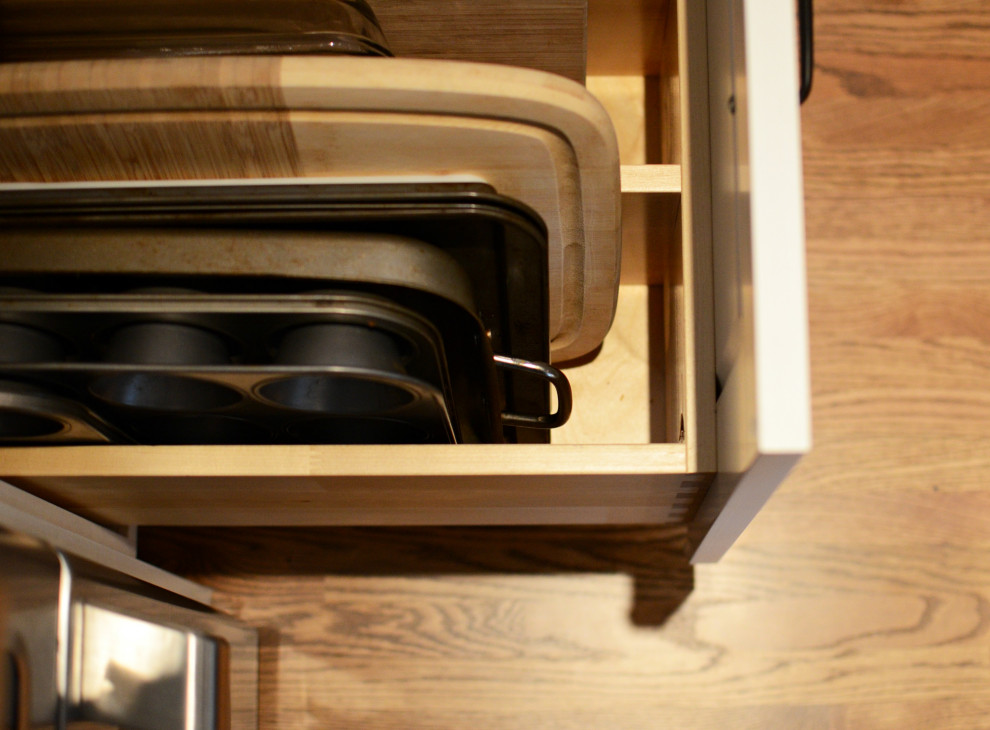 Example of a small transitional light wood floor kitchen design in Calgary