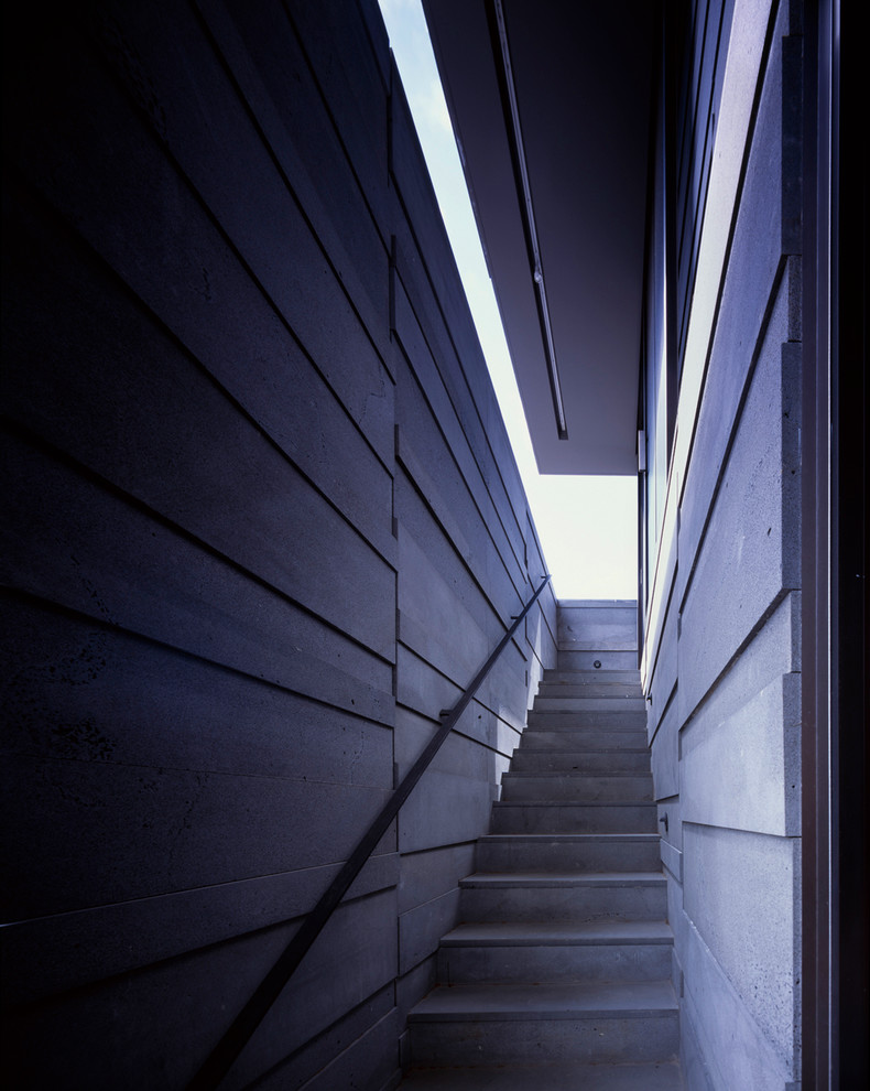 Design ideas for a large modern two-storey grey exterior in Melbourne with stone veneer.