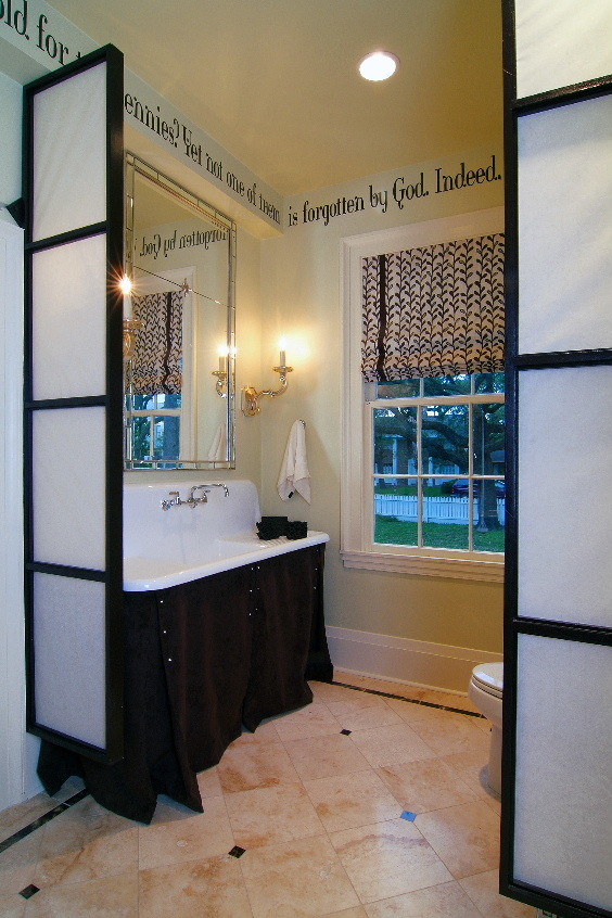 Small transitional master bathroom in Houston with a pedestal sink, furniture-like cabinets, beige tile, mosaic tile, beige walls, travertine floors, brown cabinets, a shower/bathtub combo, a one-piece toilet, beige floor, a shower curtain and a freestanding tub.
