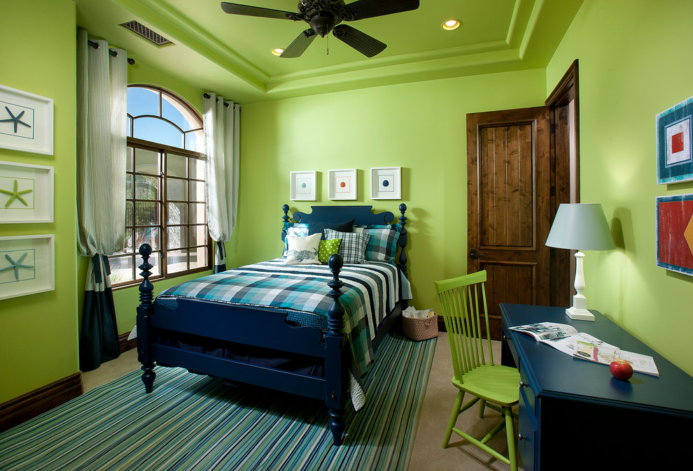 This is an example of a mid-sized traditional kids' bedroom for kids 4-10 years old and boys in Phoenix with green walls and carpet.