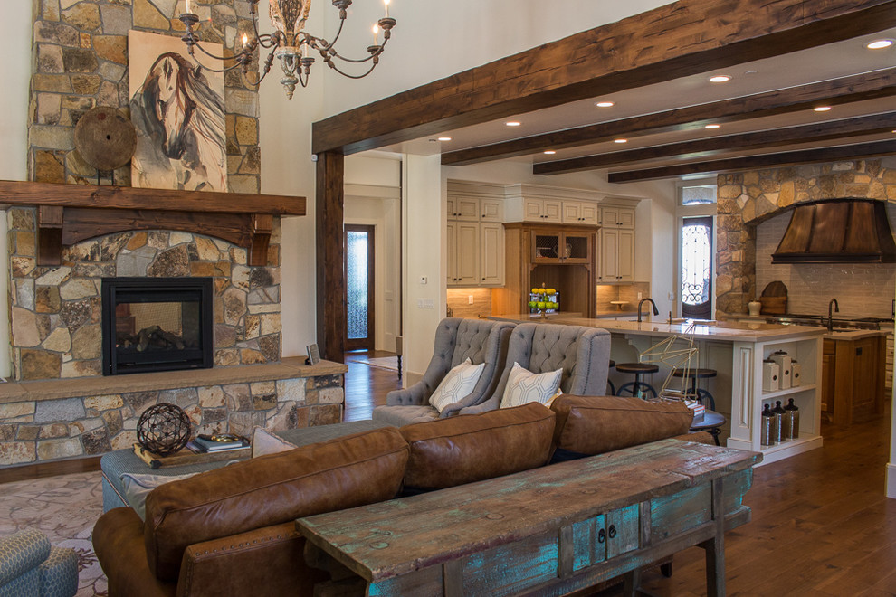 Design ideas for a mid-sized arts and crafts open concept family room in Salt Lake City with a library, beige walls, dark hardwood floors, a two-sided fireplace and a stone fireplace surround.