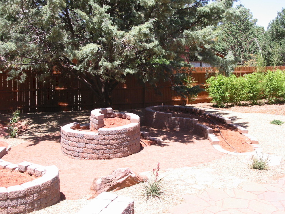 Photo of a contemporary front yard garden in Phoenix with a water feature and concrete pavers.