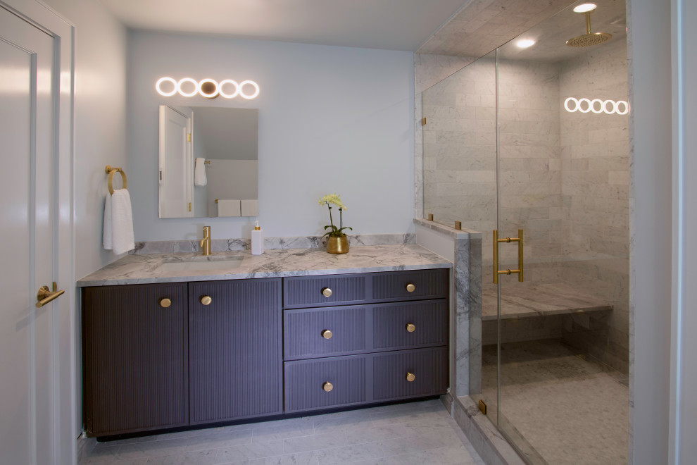 Photo of a medium sized classic family bathroom in New York with freestanding cabinets, blue cabinets, an alcove shower, a bidet, marble tiles, blue walls, marble flooring, a submerged sink, quartz worktops, grey floors, a hinged door, grey worktops, a shower bench, a single sink and a built in vanity unit.