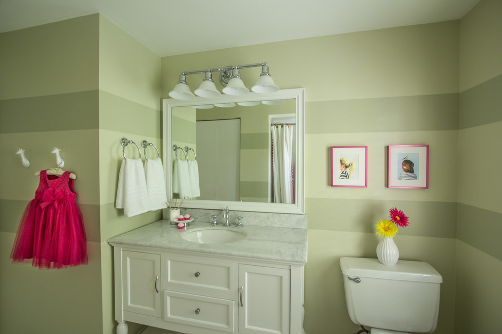 Design ideas for a small traditional kids bathroom in DC Metro with furniture-like cabinets, white cabinets, an alcove tub, an alcove shower, a two-piece toilet, green walls, marble floors, an undermount sink, marble benchtops, grey floor and a shower curtain.