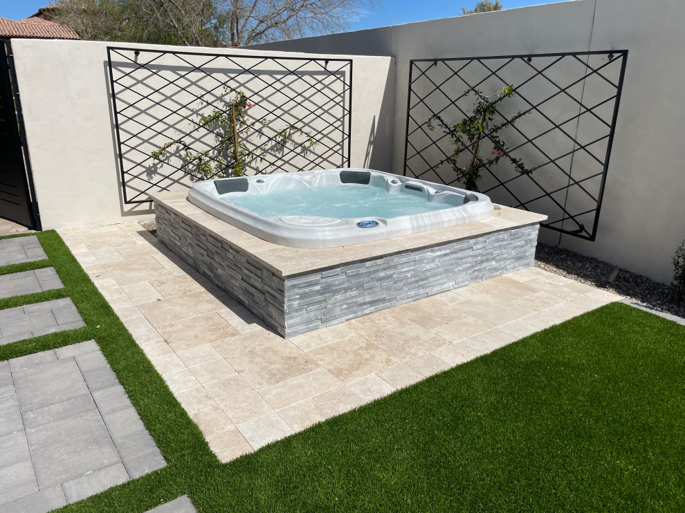 Transitional side yard concrete paver hot tub photo in Phoenix