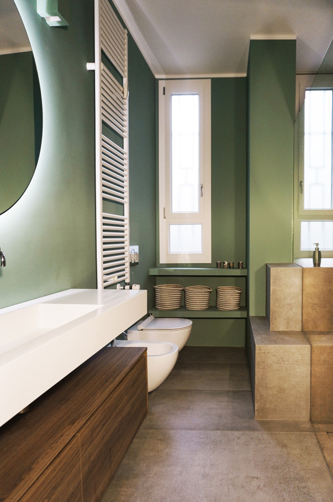 Photo of a large contemporary cloakroom in Milan with flat-panel cabinets, brown cabinets, a two-piece toilet, green tiles, porcelain tiles, porcelain flooring, a built-in sink, wooden worktops, grey floors, white worktops, a floating vanity unit and a drop ceiling.