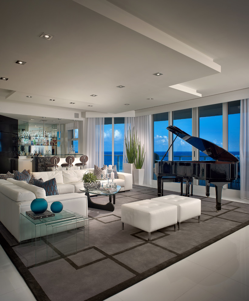 Photo of a contemporary living room in Miami with a home bar and white floor.