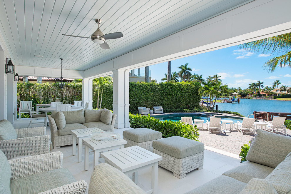 Design ideas for a tropical backyard patio in Miami.