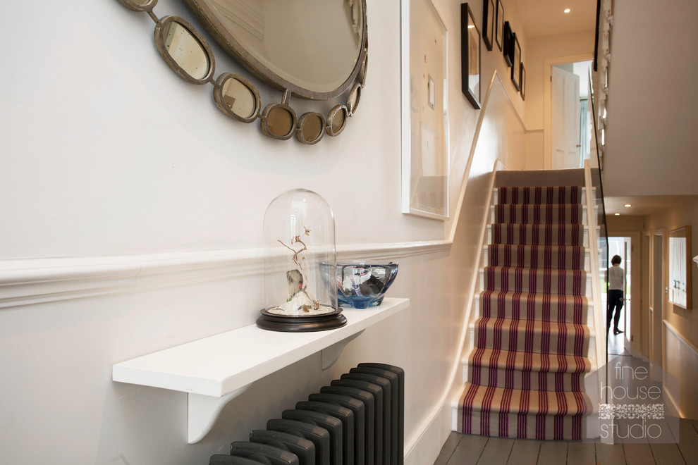 Inspiration for a large traditional hallway in Gloucestershire with white walls and carpet.