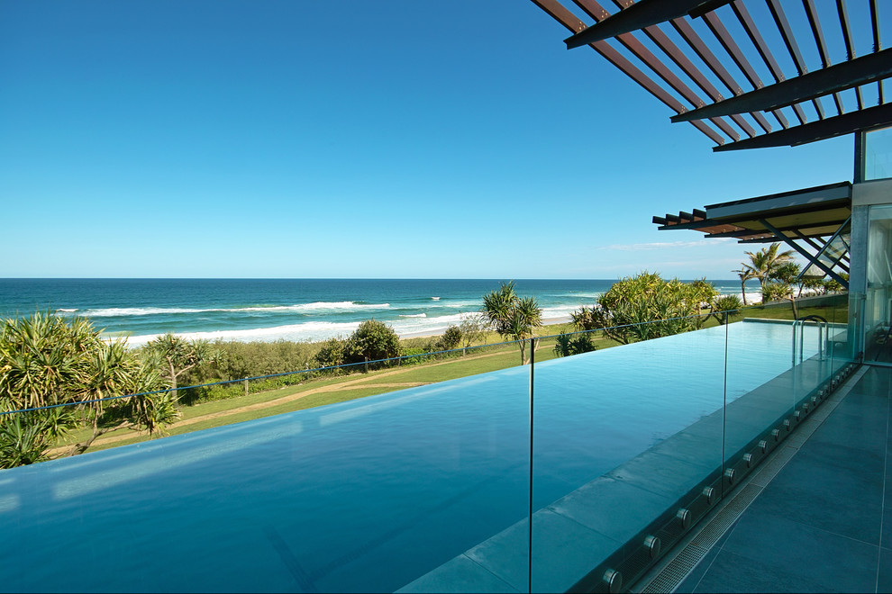 Design ideas for a large beach style rectangular infinity pool in Brisbane.