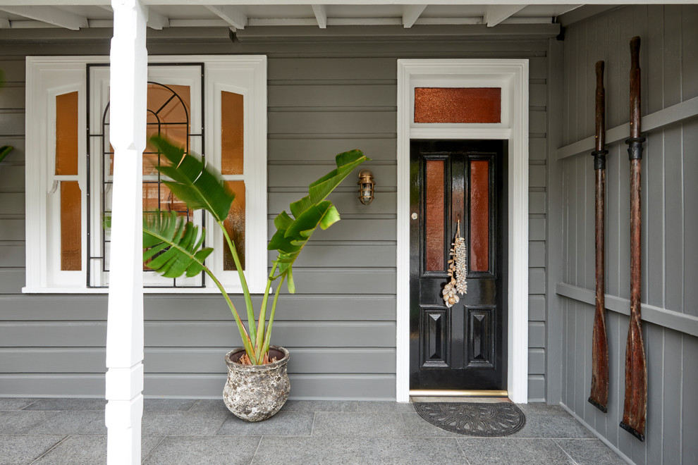 Inspiration for a contemporary front door in Sydney with grey walls, a single front door and a black front door.