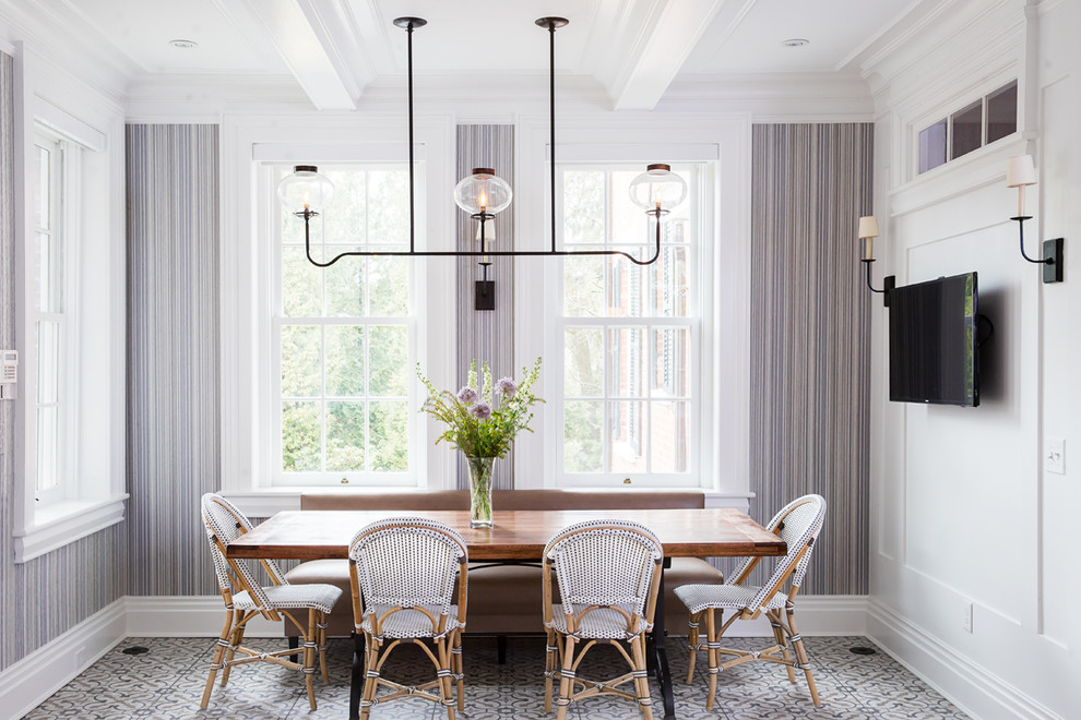 This is an example of a traditional dining room in Boston with white walls and multi-coloured floor.