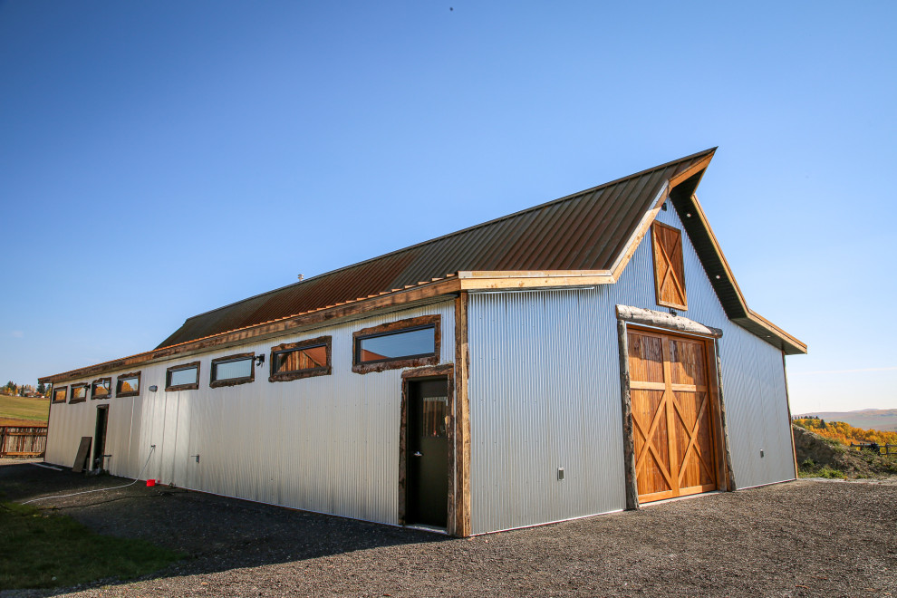 Example of a mountain style home design design in Calgary