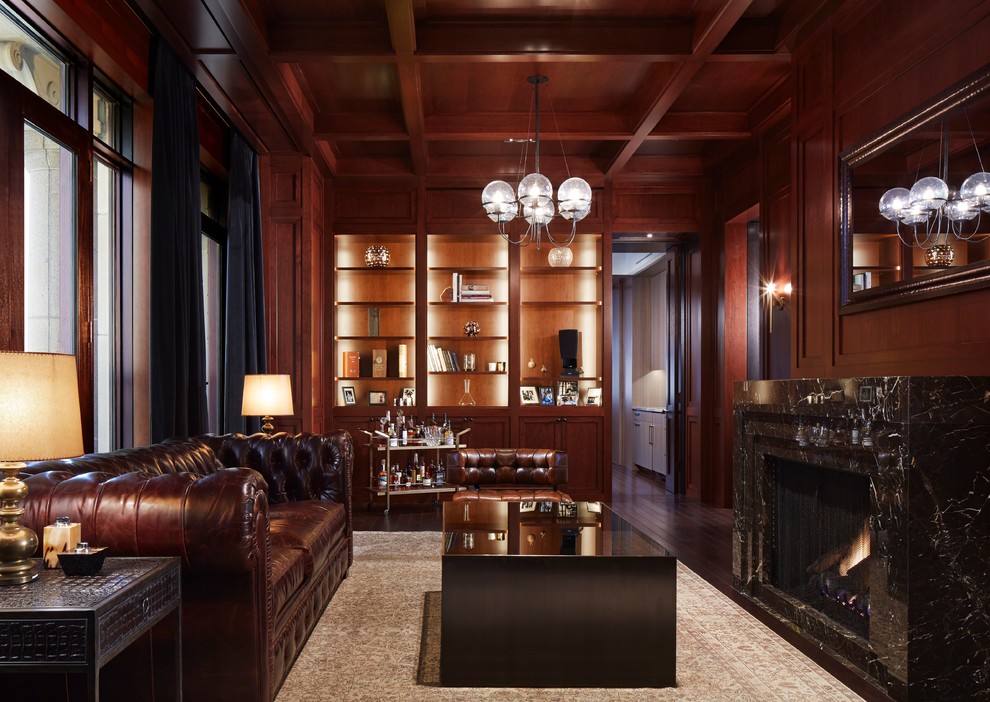 Large traditional study room in Chicago with brown walls, dark hardwood floors, a standard fireplace and a stone fireplace surround.