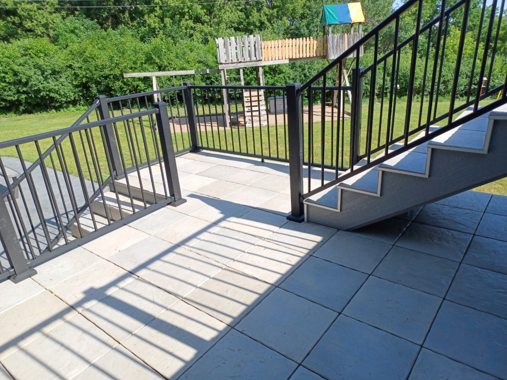 Photo of a contemporary deck in Minneapolis with metal railing.