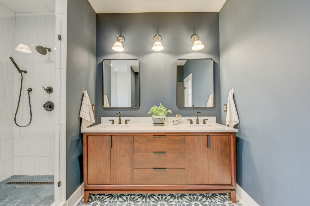 Photo of a mid-sized modern master bathroom in Atlanta with flat-panel cabinets, brown cabinets, a freestanding tub, an open shower, white tile, ceramic tile, grey walls, ceramic floors, a drop-in sink, engineered quartz benchtops, grey floor, a hinged shower door, beige benchtops, a double vanity, a freestanding vanity and coffered.