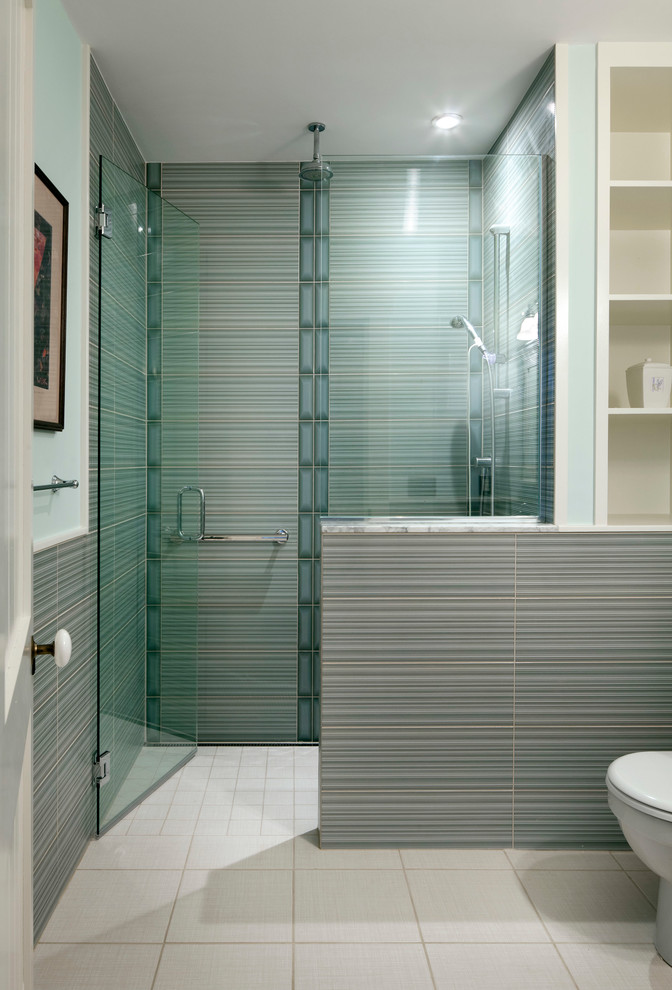 Photo of a mid-sized contemporary bathroom in Boston with a curbless shower, open cabinets, white cabinets, blue tile, porcelain tile, green walls, porcelain floors and marble benchtops.